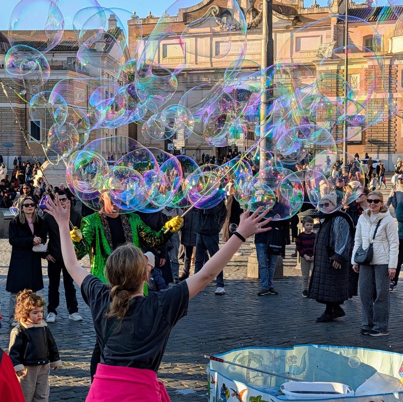 Lots of bubbles with a girl stretching up for them