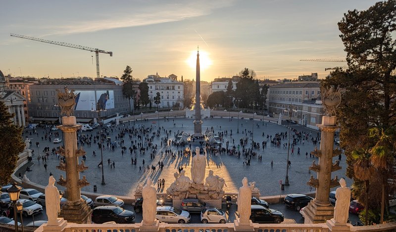 Sunset framed behind the obelisk, looking down from the terrace stairs above