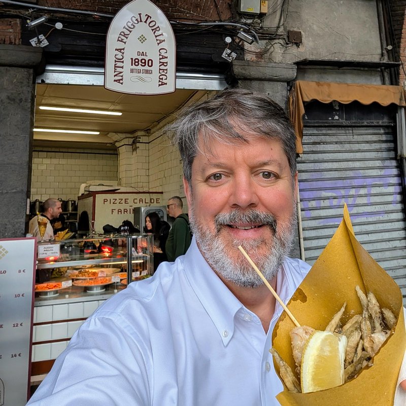 Selfie with fried seafood, including rossetti, calamari, and one shell-on shrimp.