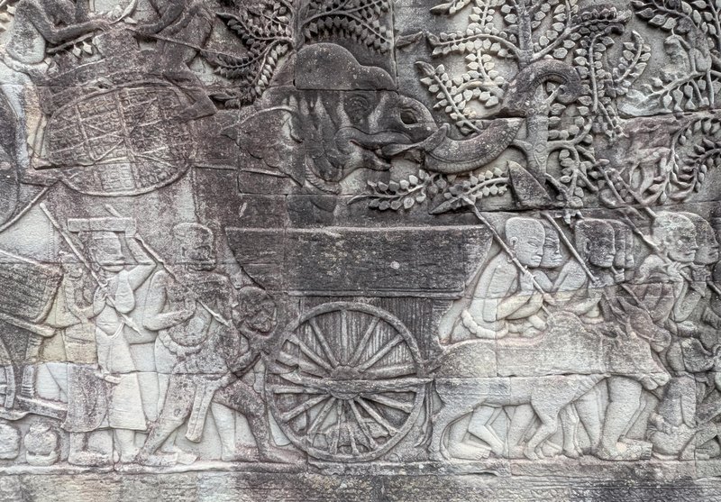 An elephant, a cart, etc on a relief sculpture