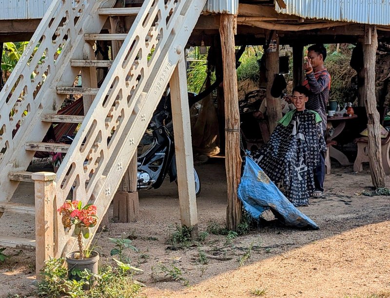 A haircut in the downstairs of a house
