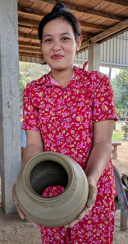 A beautiful and very skilled pot maker with a half-finished pot