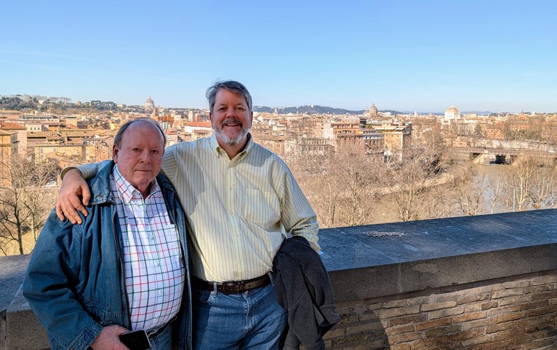 Ken and me overlooking the Tiber. St. Peter's Basilica is there in the background